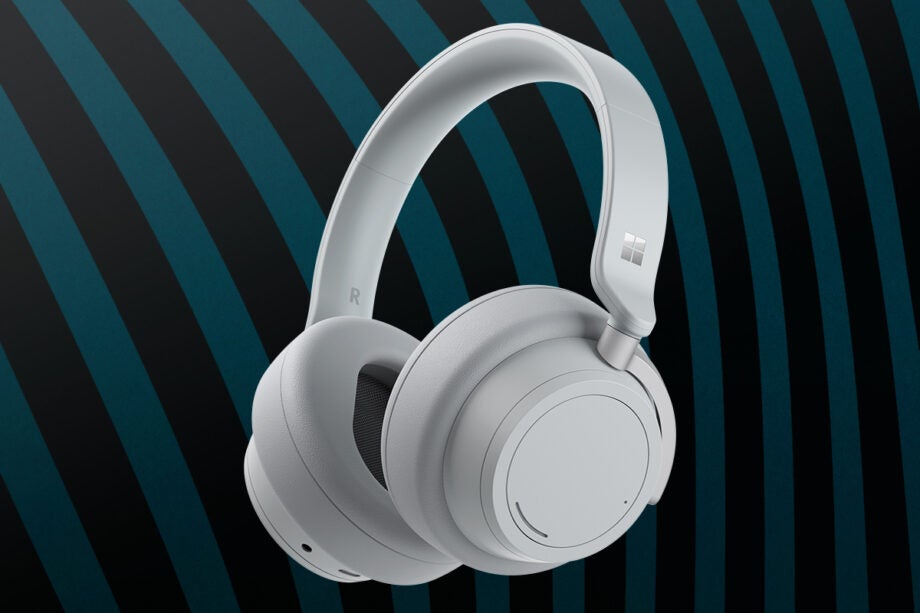 white heaphones on black green backgroud, with a Windows logo on side of headband