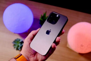 iPhone 14 Pro held in hand showing the back
