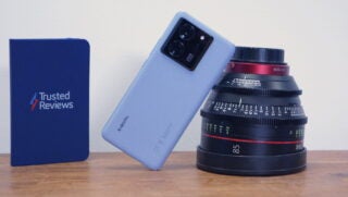 Xiaomi 13T Pro on its side leaning on a camera lens